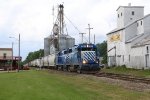 GLC 385 rolls past the old elevator and feed mill
